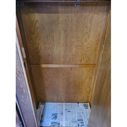 91 - An Art Deco style oak single door wardrobe