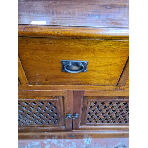 92 - An Ancient Mariner mahogany sideboard with three drawers and two cupboard doors - approx. 85cm high ... 