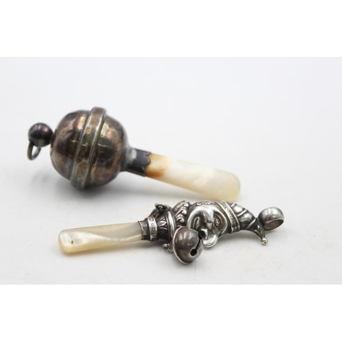 1253 - Two .925 silver baby rattles with mother of pearl handles - approx. gross weight 34 grams