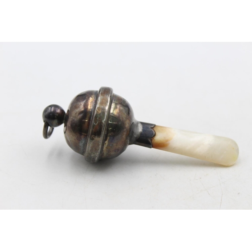 1253 - Two .925 silver baby rattles with mother of pearl handles - approx. gross weight 34 grams