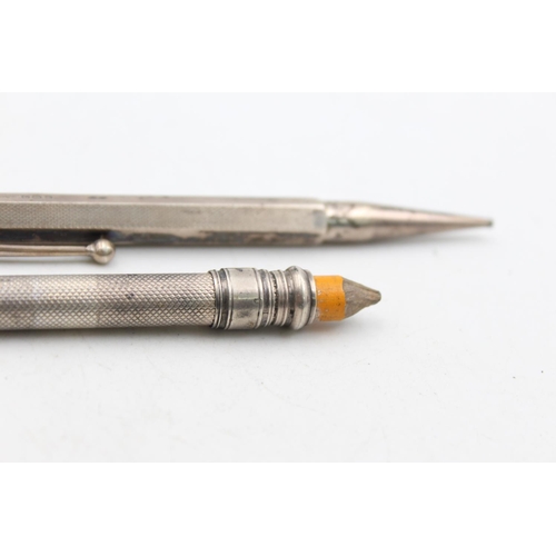 1279 - Two hallmarked silver propelling pencils - approx. gross weight 35 grams