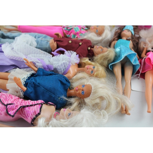 370 - A collection of fashion dolls to include Barbie, Ken etc.