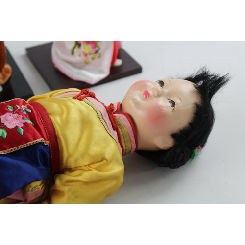 370A - Five vintage Oriental collectors dolls