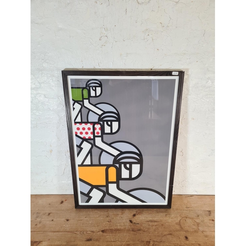 149 - Two items, one Art Deco style frameless wall mirror and one framed John Lewis group of cyclists prin... 