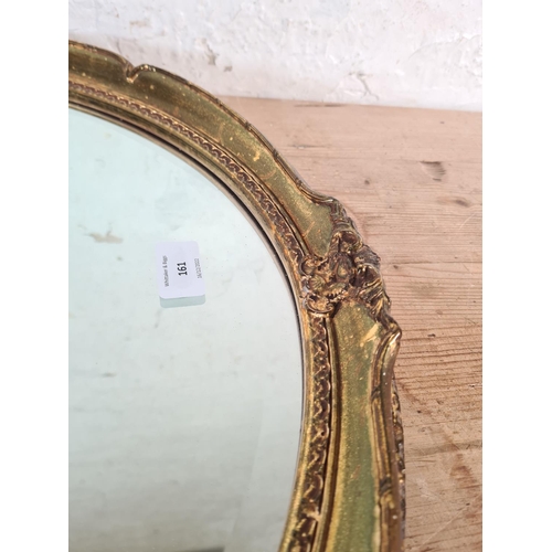 161 - A 19th century style gilt framed oval bevelled edge wall mirror - approx. 66cm high x 56cm wide