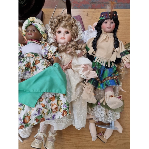 379 - A large collection of vintage Alberon porcelain dolls to include Native American, Paul Baby Boy etc.