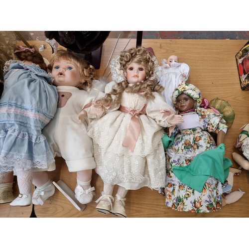 379 - A large collection of vintage Alberon porcelain dolls to include Native American, Paul Baby Boy etc.