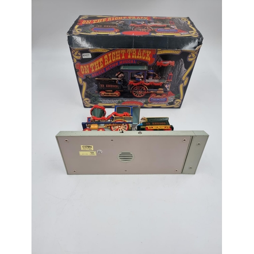 380 - A boxed vintage Enesco The Enesco Express No. 33 On The Right Track Deluxe Action musical model trai... 