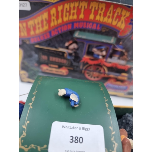 380 - A boxed vintage Enesco The Enesco Express No. 33 On The Right Track Deluxe Action musical model trai... 