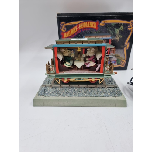 381 - A boxed vintage Enesco Railway Romance Deluxe Action musical model carriage with power adapter