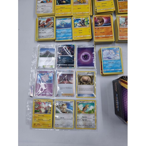 384 - A large collection of Pokémon trading cards to include Japanese etc.