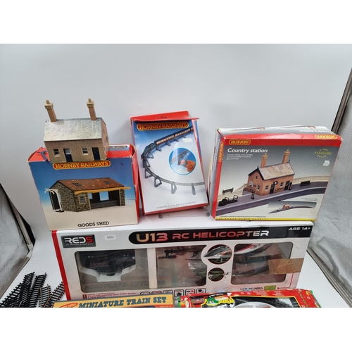 392 - A collection of assorted toys and games to include boxed Red 5 U13 radio controlled helicopter, Trac... 