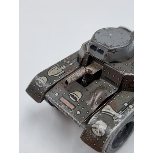 397 - A vintage tin plate clockwork model tank