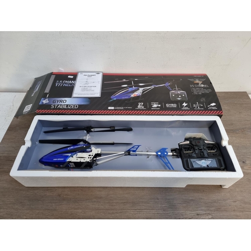 402 - A boxed Flying Gadgets 3.5 channel T77 gyro stabilised remote control helicopter