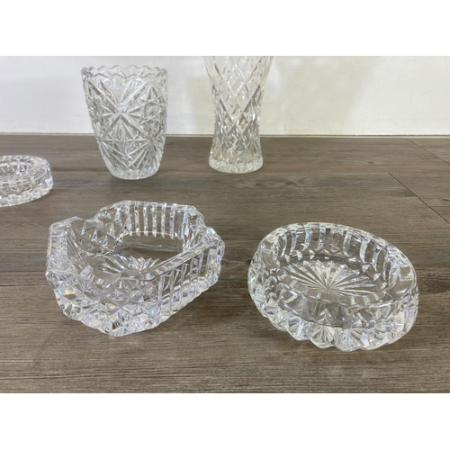 272 - Seven pieces of cut glassware, five ash trays and two vases - largest approx. 21cm high