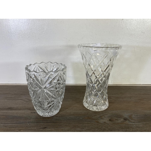 272 - Seven pieces of cut glassware, five ash trays and two vases - largest approx. 21cm high