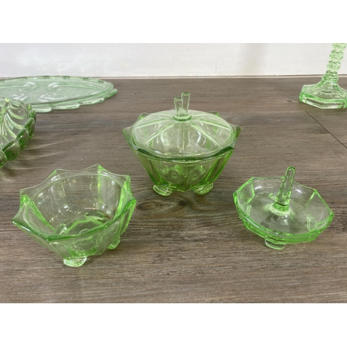 288 - A collection of vintage uranium glassware to include candlesticks, ring holder etc.