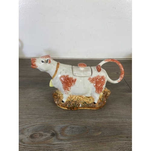 289 - A collection of ceramic cow creamers and figurines to include Fairmont & Main Down On The Farm Lulu,... 