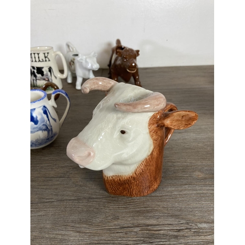 291 - A collection of cow themed ceramics to include Border Fine Arts The Young Herriot Studio Collection ... 