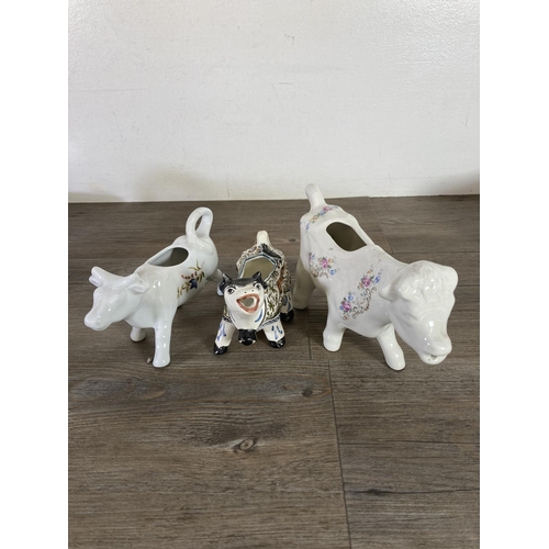 291 - A collection of cow themed ceramics to include Border Fine Arts The Young Herriot Studio Collection ... 