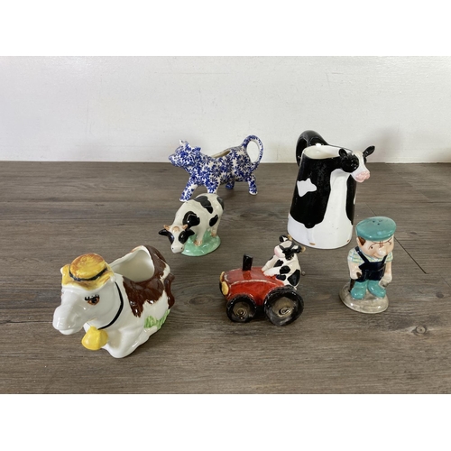 291 - A collection of cow themed ceramics to include Border Fine Arts The Young Herriot Studio Collection ... 