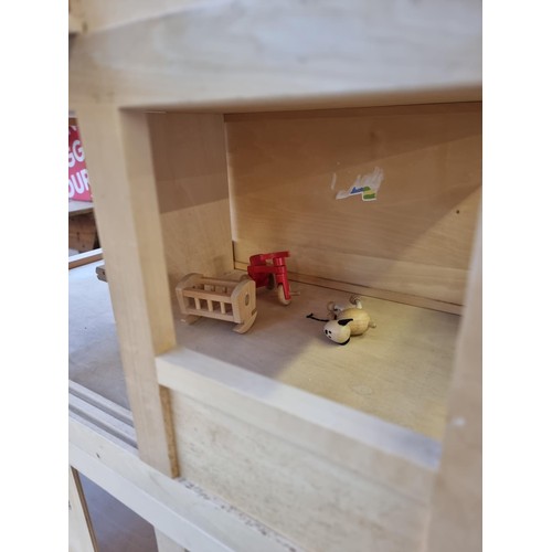 405 - A wooden three piece doll's house with various furniture and accessories