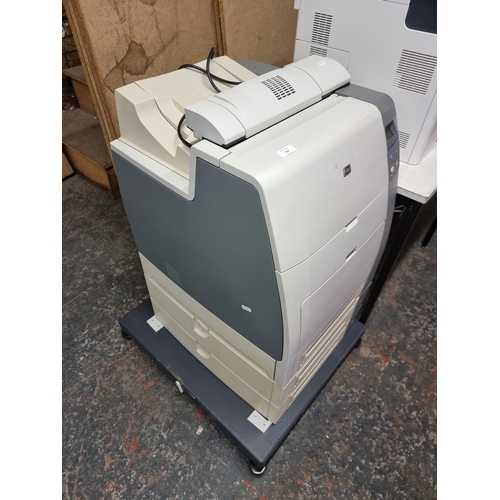 790 - An HP 4700dtn colour LaserJet floor standing office computer printer