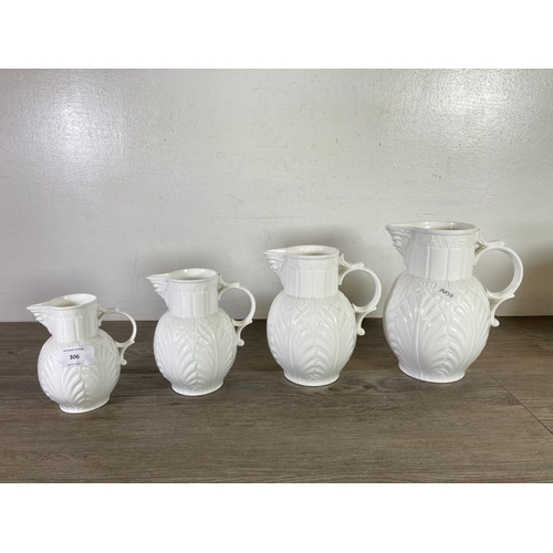 306 - Six pieces of china, four Coalport The Caughley mask head jugs, one Aynsley Wild Tudor jug and one A... 