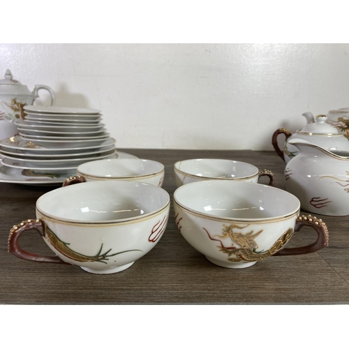 316 - An Oriental lithophane twenty seven piece tea set