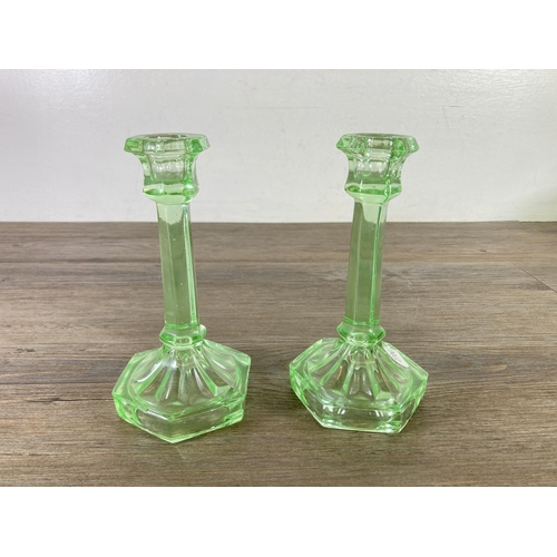 320 - Four pieces of vintage uranium glassware, one 24cm bowl, two candlesticks and one lidded jar