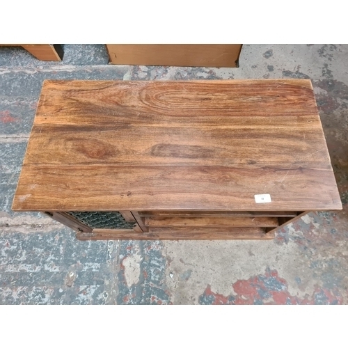 18 - An Indian sheesham wood TV stand - approx. 50cm high x 81cm wide x 40cm deep