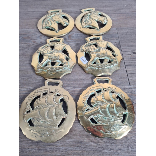 335 - Six large horse brasses, two elephant and basket design, two horse head design and two sailing ship ... 