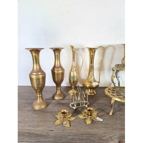 340 - Eleven pieces of brassware to include two trivet stands, pierced circular planter, novelty five sect... 