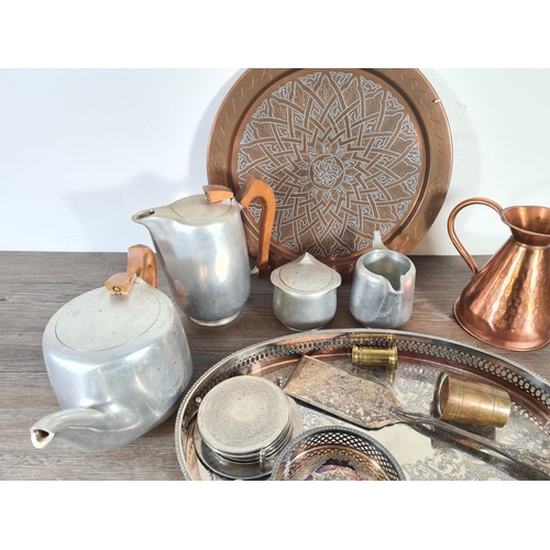 349 - A collection of metalware to include copper charger, copper jug, four pieces of Picquot Ware etc.