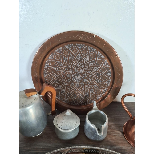 349 - A collection of metalware to include copper charger, copper jug, four pieces of Picquot Ware etc.