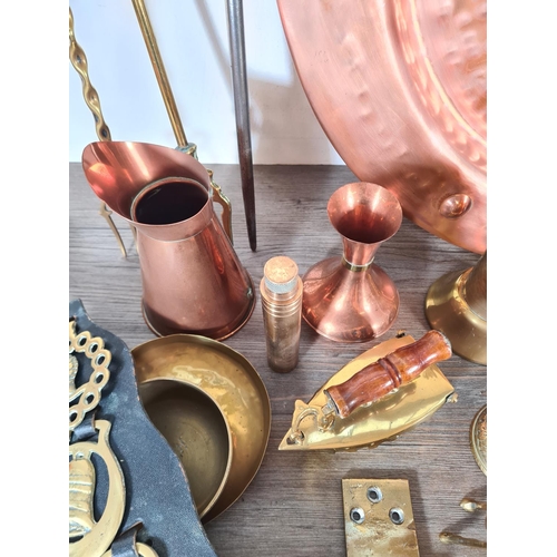 359 - A collection of copper and brassware to include Arts & Crafts style charger, planters, horse brasses... 