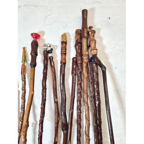 363 - Sixteen vintage novelty walking sticks to include owl, Egyptian etc.