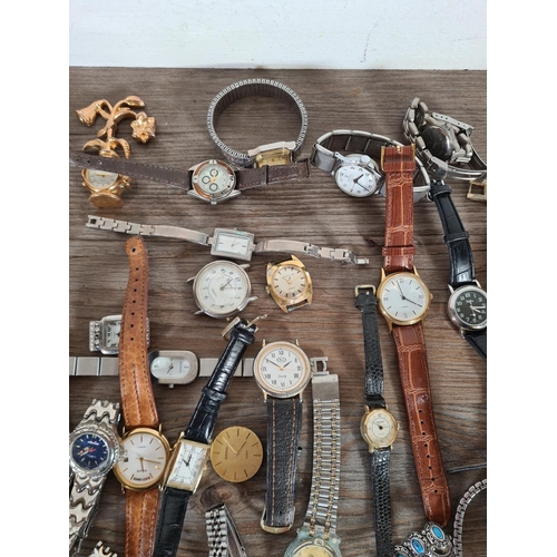 414 - A large collection of watches to include Timex, Saxon, Infinite etc.