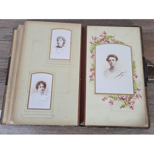 476 - A Victorian carte de visite album containing approx. thirty five cards