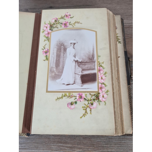 476 - A Victorian carte de visite album containing approx. thirty five cards