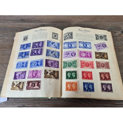 481 - A Royal Mail stamp album containing antique and vintage worldwide stamps