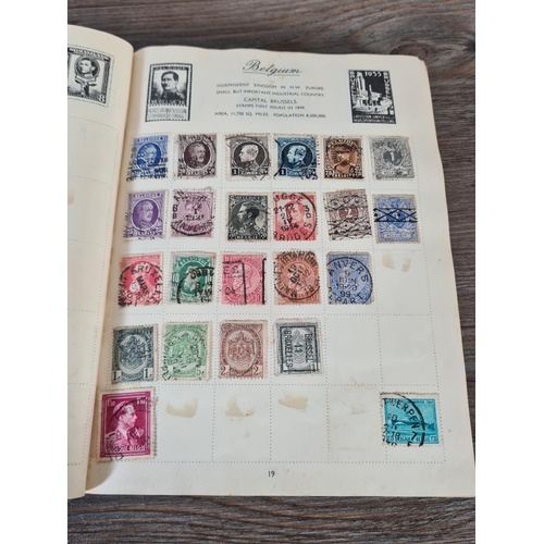 481 - A Royal Mail stamp album containing antique and vintage worldwide stamps