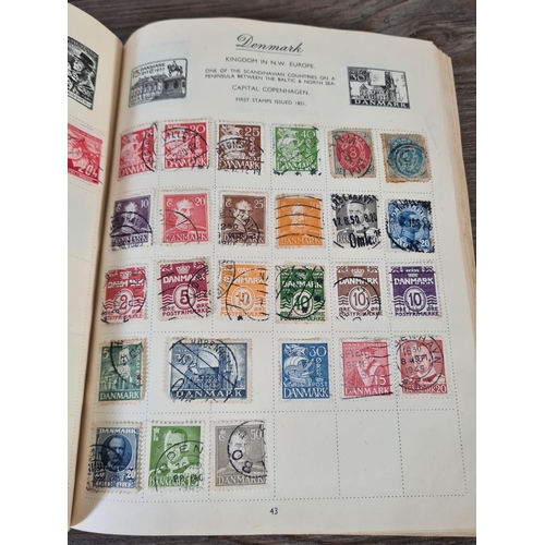 481 - A Royal Mail stamp album containing antique and vintage worldwide stamps