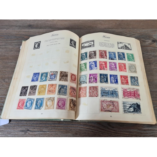 481 - A Royal Mail stamp album containing antique and vintage worldwide stamps