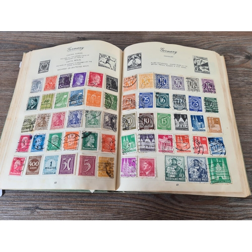 481 - A Royal Mail stamp album containing antique and vintage worldwide stamps