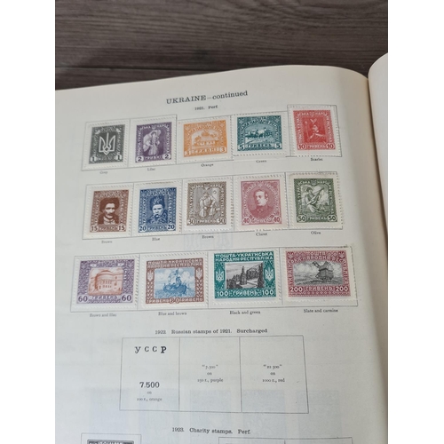 482 - A Stanley Gibbons Ltd The Ideal Postage Stamp Album containing antique and vintage worldwide stamps