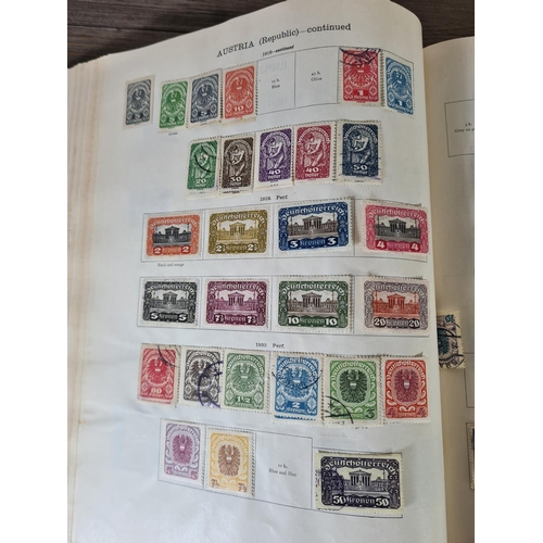 482 - A Stanley Gibbons Ltd The Ideal Postage Stamp Album containing antique and vintage worldwide stamps