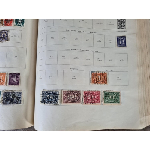 482 - A Stanley Gibbons Ltd The Ideal Postage Stamp Album containing antique and vintage worldwide stamps