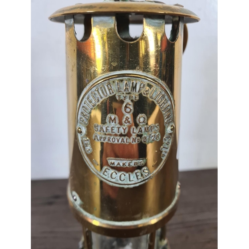 491 - A vintage The Protector Lamp & Lighting Co. Ltd Eccles type 6 brass miner's lamp - approx. 25cm high