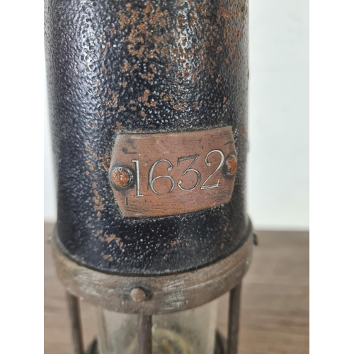 494 - An early 20th century brass and steel miner's lamp stamped NHC Patent 4562 - approx. 25cm high